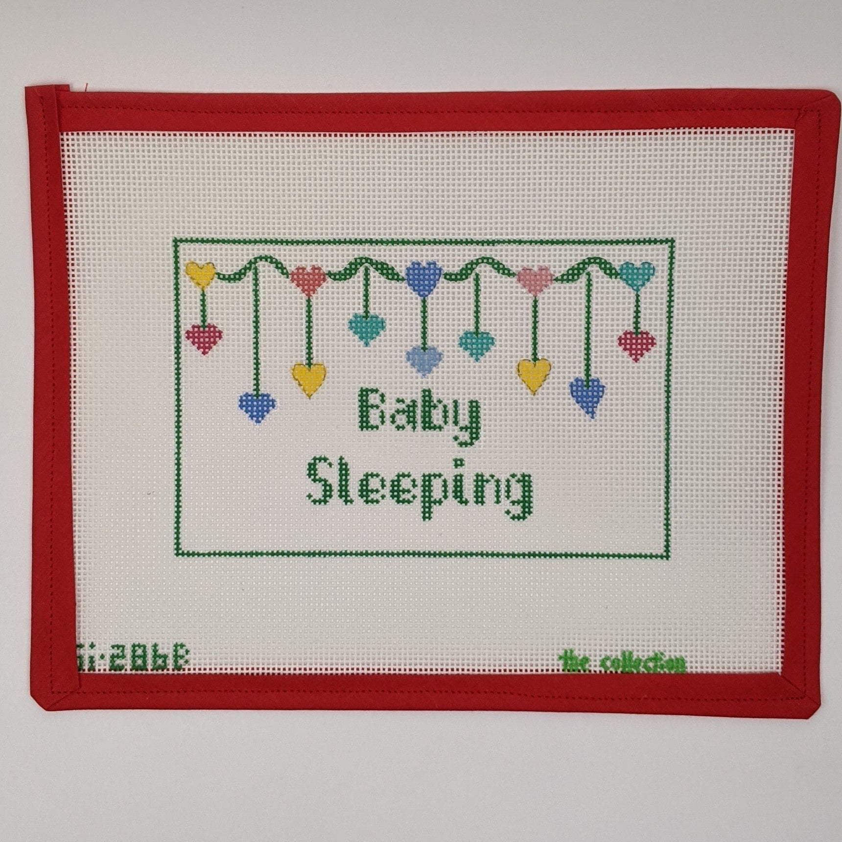 Baby Sleeping with Hanging Hearts