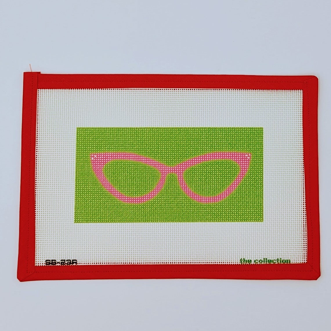 Pink Cat Eyeglasses on Green